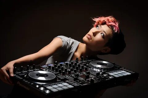 Wallpaper Girl with pink bangs with a DJ remote control in h