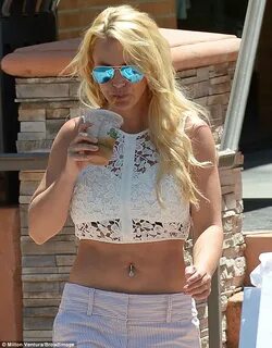 Britney Spears flashes toned tum and belly button ring as sh