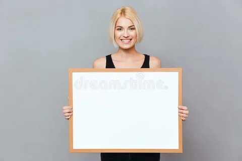 204 Beautiful Young Girl Holding Empty Blank Board Over Blue