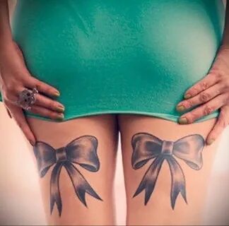 Porn stars with ribbon on thigh like pink tattoo