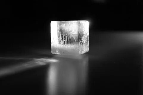 Day 47: "Prism" An ice cube bends and reflects light, reve. 