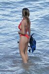 sydney sweeney heats up the beach in a red bikini as she goe