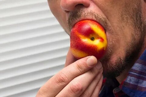 Man Eating Peach - Сток картинки - iStock