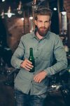 Casual men`s life. Handsome stylish young red bearded man in