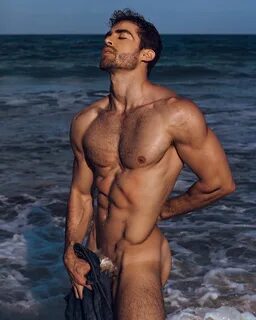 Barely dressed bubble-butted model David Ortega at the beach