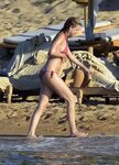Emily Vancamp shows off her round ass & under-boob in red bi