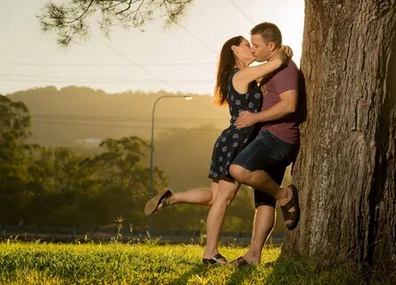 Romantic Kiss in Park with Sunlight - Gold Coast Family Port