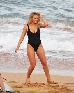 Lara Bingle gets wild on the beach for new swimwear photosho