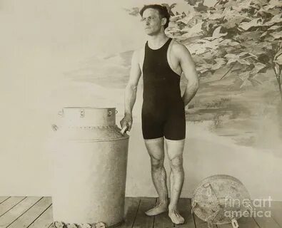 Harry Houdini about to perform the great milk can escape Pho
