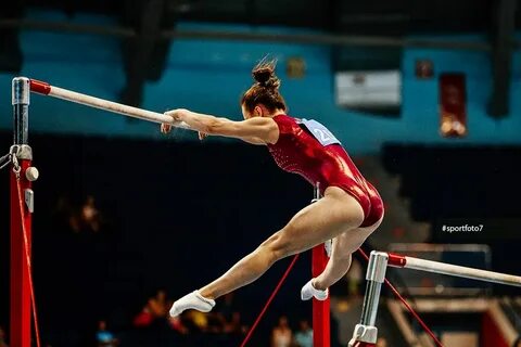 uneven bars female gymnast to competition in artistic gymnas