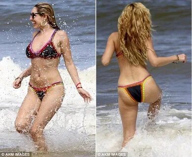 Kelly Brook flaunts her curvy figure in a colourful bikini