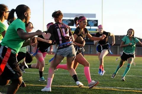 A senior breaks a freshmen defense Oct. 2 during a powder pu