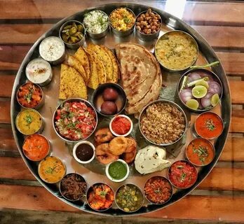 This enormous thali includes more than 25 dishes apart from 