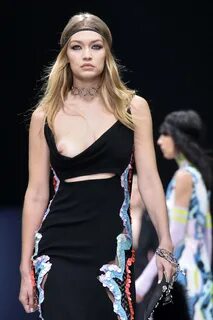Gigi Hadid showing her bare boob on a runway at the Versace 
