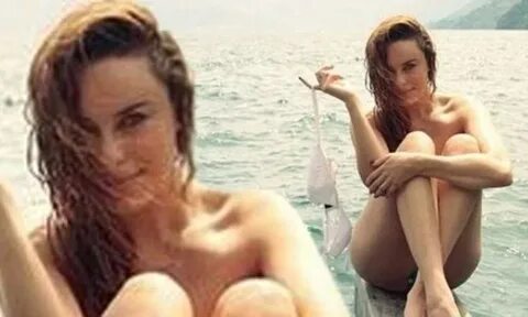 Jessica McNamee goes topless as she takes to the water in Gu