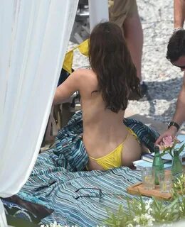 Dakota Johnson - In a yellow bikini on the set of Fifty Shad