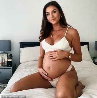 Pregnant Shelby Tribble shows off her bump in white lingerie