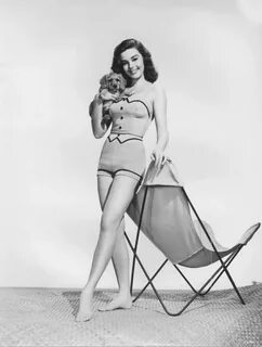 Elaine Stewart with a puppy - 24 Femmes Per Second