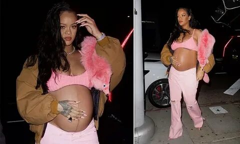 Heavily pregnant Rihanna exposes her growing baby bump