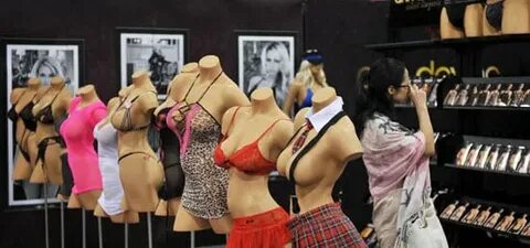 Busty mannequins show off risqué lingerie. Asia Adult Expo P