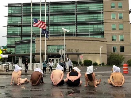 Naked Protesters Wear 'Spit Hoods' In Upstate New York To De