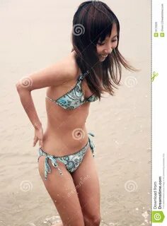 Cute playful asian teen bikini