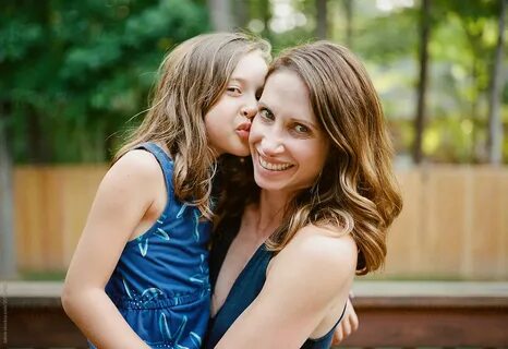 Daughter Kissing Mother's Cheek by Jakob Lagerstedt