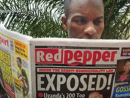 A man reads a copy of Red Pepper on Tuesday in Kampala, Ugan