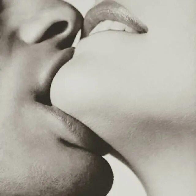 May be a black-and-white image of one or more people and people kissing. 