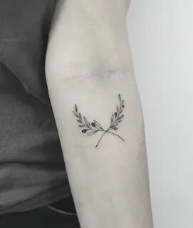 Olive branches tattoo on the inner arm. #plant #tattoo #oliv