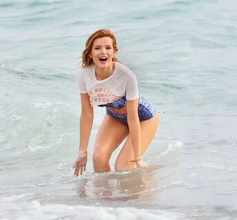 BELLA THORNE in Bikini on the Set of a Photoshoot at a Beach