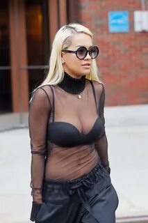 Rita Ora see-through to bra while leaving a radio station in