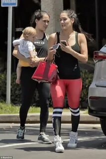 Nikki Bella sports bright red leggings for quick workout wit