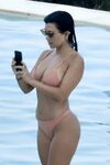 Kourtney Kardashian in Bikini on the pool in Costa Smeralda 