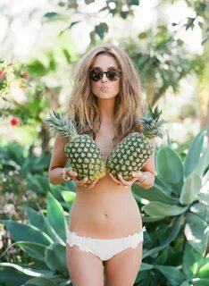 Funny and sexy portrait of bride holding pineapples - Greg F