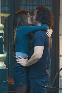 Poldark hunk Aidan Turner can't resist a kiss and a dance wi