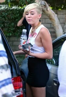 Miley Cyrus braless showing side boob outside the 'Whole Foo