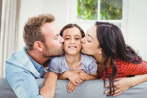 Mother, Father and Son Looking at Digital Tablet Stock Photo