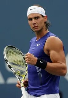 Rafael Nadal biceps muscles .babolat tennis racket, nike sho