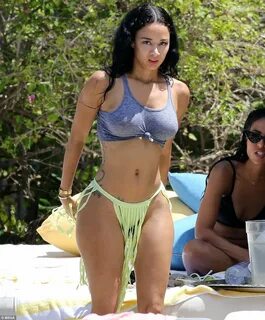 Draya Michele brings the heat to Miami in hot pink swimsuit 