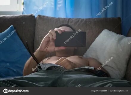 Young Man Watching Pornography Masturbating.