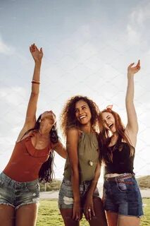 Female friends enjoying summer containing african, beach, an