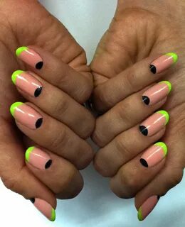 neon green french tips and black half moons on pink manicure