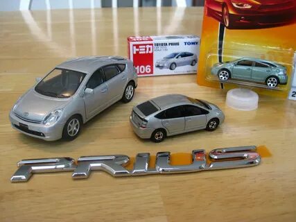 My diecast Prius family 1:34 Kinsmart at left. Top and cen. 