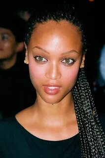 Young Tyra with pretty braids. These look like cornrows. *sq