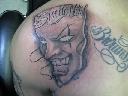 Smile now cry later part 1 Tattoo of smiling face on shoul. 