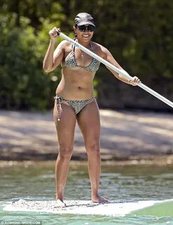 Jessica Mauboy slips into a string bikini to go paddle board