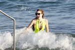 Lindsay Lohan - wearing a swimsuit at a beach in Ibiza adds 