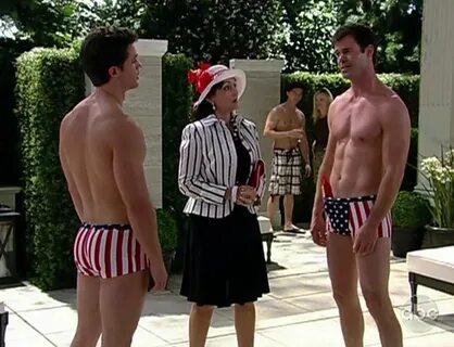 Hunky Tuc Watkins and David A. Gregory in patriotic swimwear