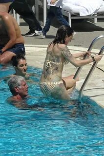Asia Argento in Bikini at the Hotel Hilton’s Swimming Pool i